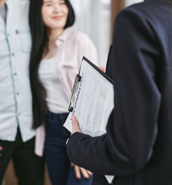 Professional meeting discussion with focus on business documents