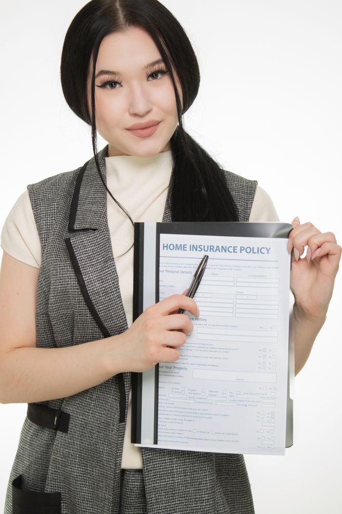 Woman presenting a home insurance policy