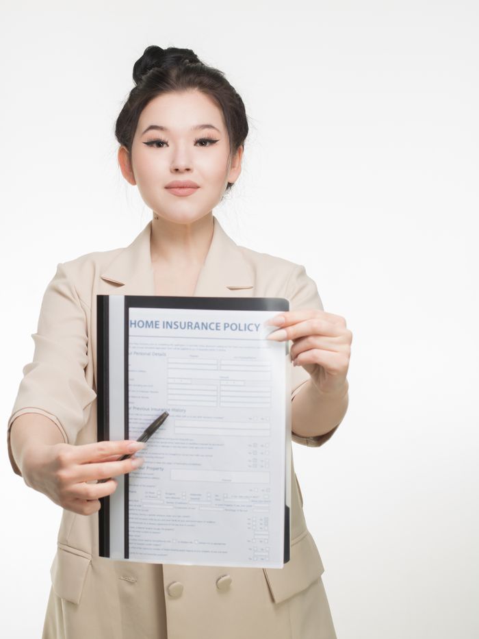 Professional woman showcasing an insurance policy