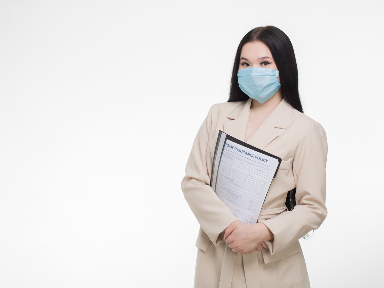 Professional woman holding an insurance document